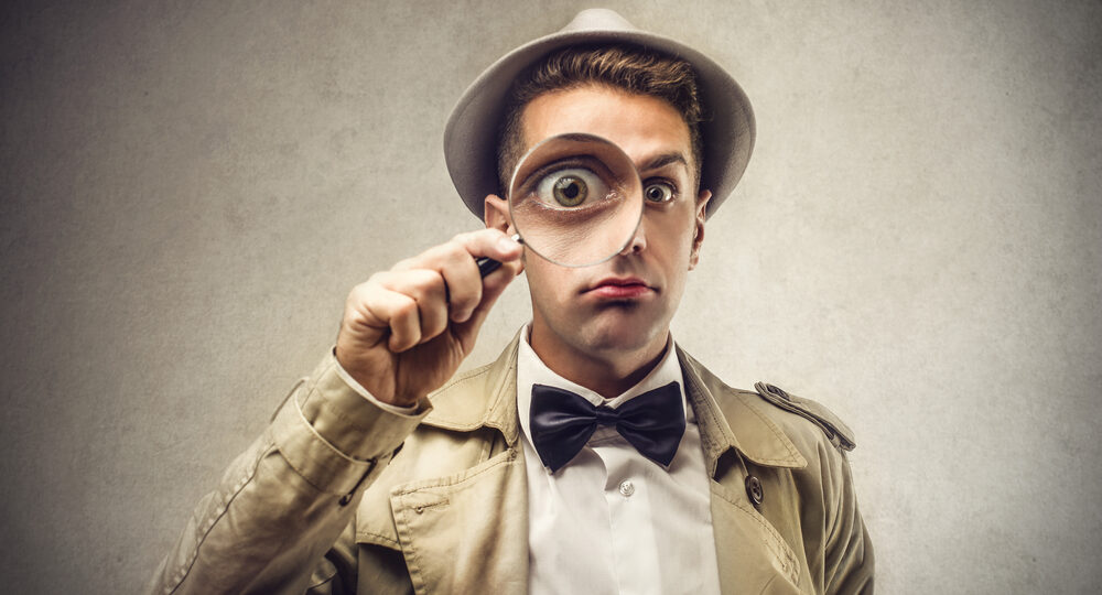 Investigator,Looking,With,Magnifying,Glass
