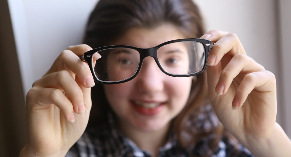 Happy,Teenager,Shortsighted,Girl,With,Myopia,Wearing,New,Sight,Correction