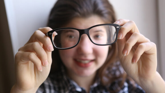 Happy,Teenager,Shortsighted,Girl,With,Myopia,Wearing,New,Sight,Correction