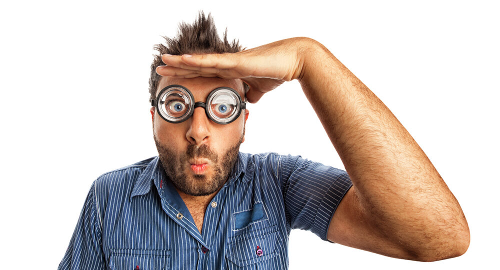 Man,With,Funny,Expression,And,Thick,Glasses,Looking,Far,Away