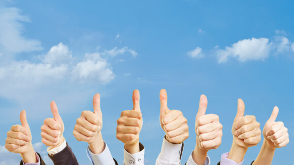 Business,Team,Under,The,Sky,With,Thumbs,Up