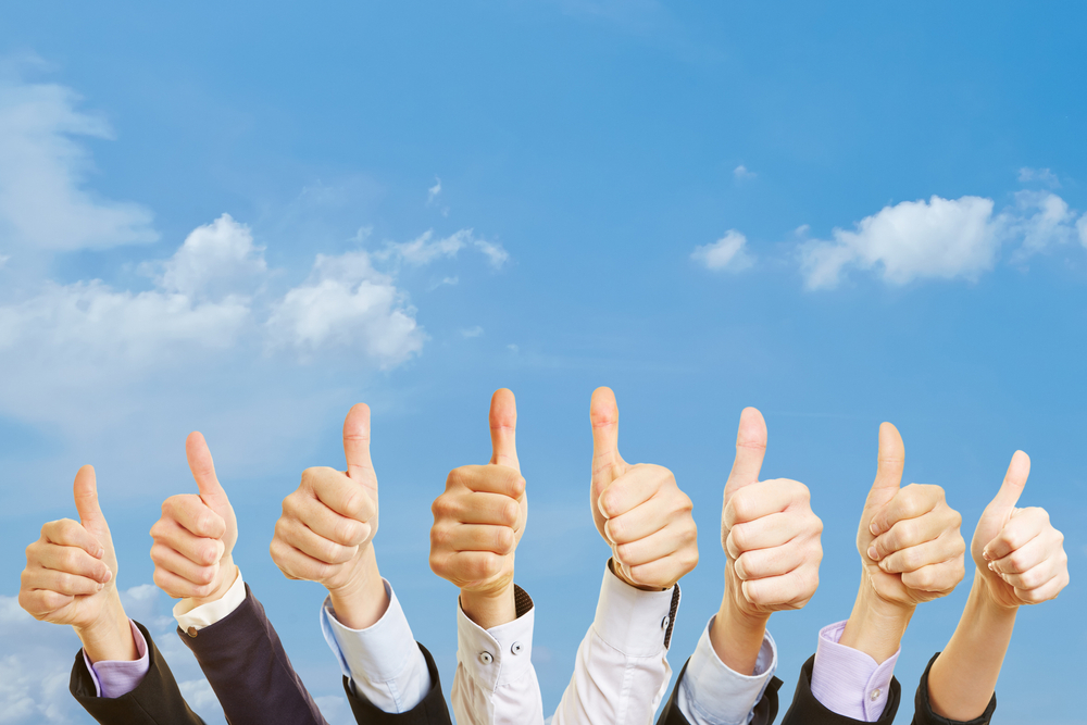 Business,Team,Under,The,Sky,With,Thumbs,Up
