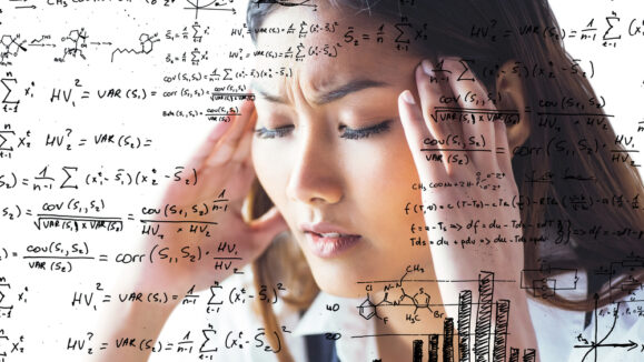 Nervous,Businesswoman,Holding,Her,Head,Against,Maths,Equations