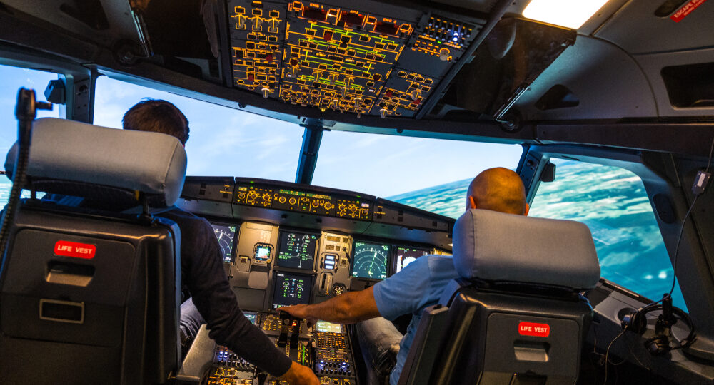 Modern,Airbus,Airplane,Cockpit,With,Pilots,During,A,Training,Session