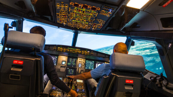 Modern,Airbus,Airplane,Cockpit,With,Pilots,During,A,Training,Session