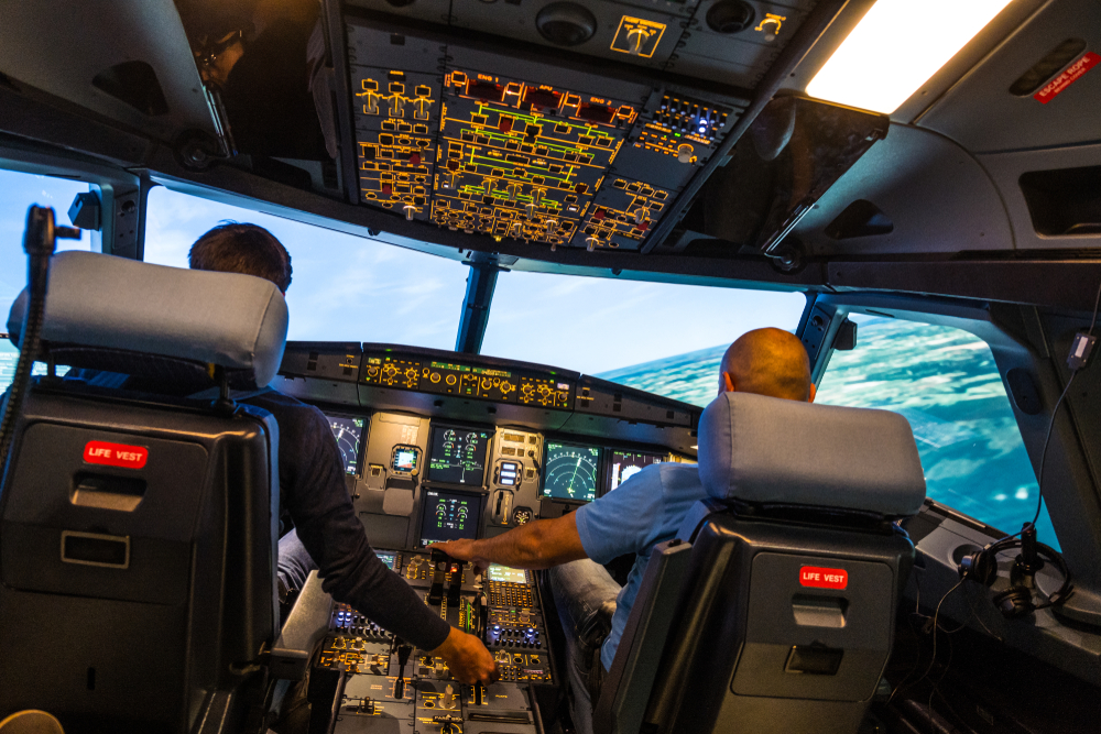 Modern,Airbus,Airplane,Cockpit,With,Pilots,During,A,Training,Session